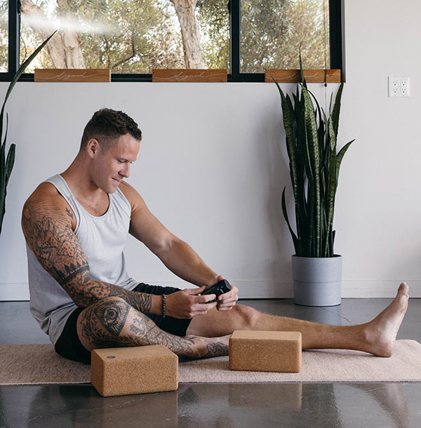 Man holding raw botanics product